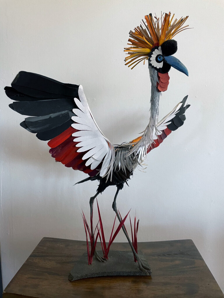 Carla Elizabeth DeMello • <em>African Crowned Crane  </em> • Sculpted paper and gouache • 19″×20″×13″ • NFS
