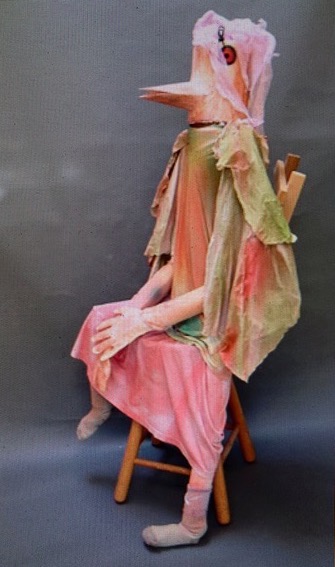Mary Ann Bowman • <em>Bird With Chair</em> • Cloth, fabric, cardboard • 20″×5″×23″ • $1,599.00