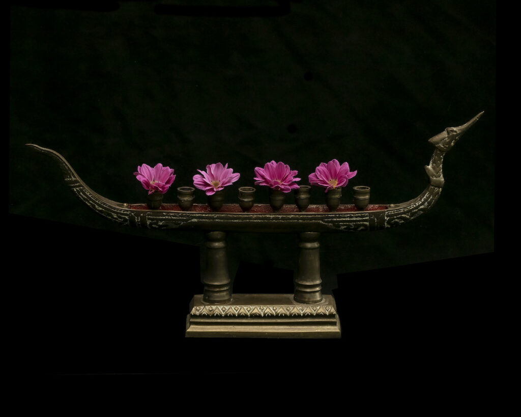 Nancy V. Ridenour • <em>Thai Bronze Boat Candlestick and Mums</em> • Digital print on canvas • 16″×20″ • $150.00