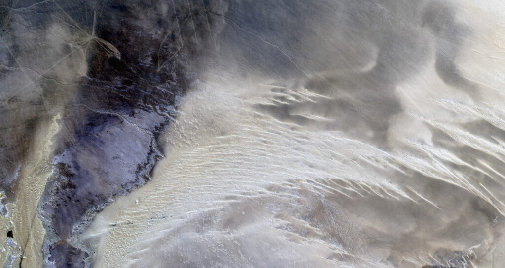 Jay Hart • <em>Sugary Dunes in Eastern Libya</em> • Natural color Landsat over shaded elevation • 80″×43″ • $1,250.00