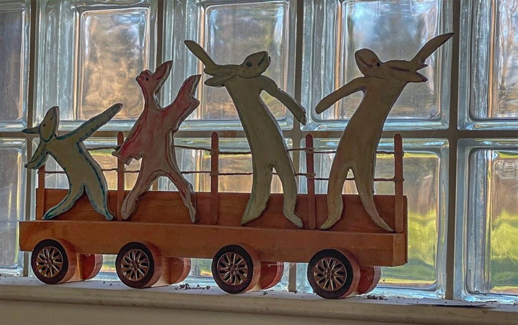 Mary Ann Bowman • <em>Let Loose on Wheels</em> • Wood, stoneware • 25″×12″×5″ • $750.00<a class="purchase" href="https://state-of-the-art-gallery.square.site/product/mary-ann-bowman-let-loose-on-wheels/2003" target="_blank">Buy</a>