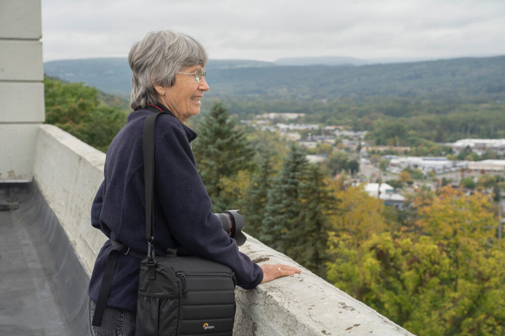 Susan C. Larkin • <em>Connie Thomas at the Former Morse Chain on South Hill</em> • Archival digital print • 20″× 16″ • $200.00