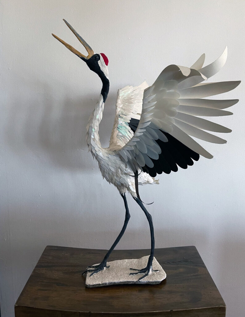 Carla Elizabeth DeMello • <em>Red Crowned Crane</em> • Sculpted paper on wireframe • 20″×23″×15″ • NFS