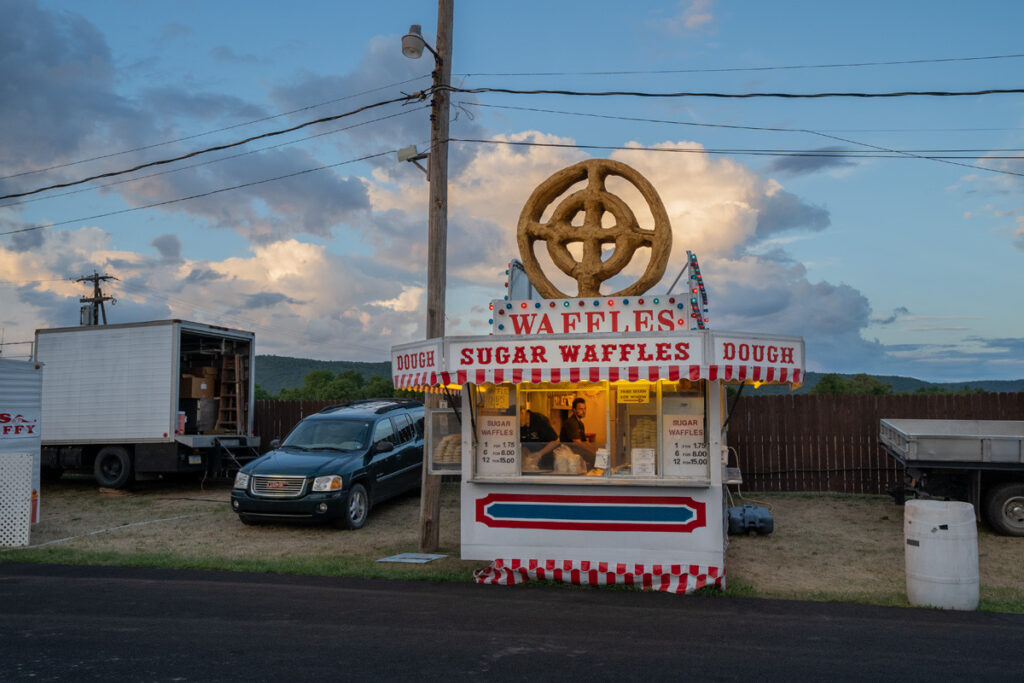 Harry Littell • <em>Chemung County Fair: Sugar Waffles, 2022</em> • Archival digital print • 28″×21″ • $475.00<a class="purchase" href="https://state-of-the-art-gallery.square.site/product/harry-littell-chemung-county-fair-sugar-waffles-2022/1825" target="_blank">Buy</a>