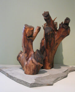 Eva M. Capobianco • <em>High Five</em> • Found wood on stone • 12″×21″×14″ • $225.00