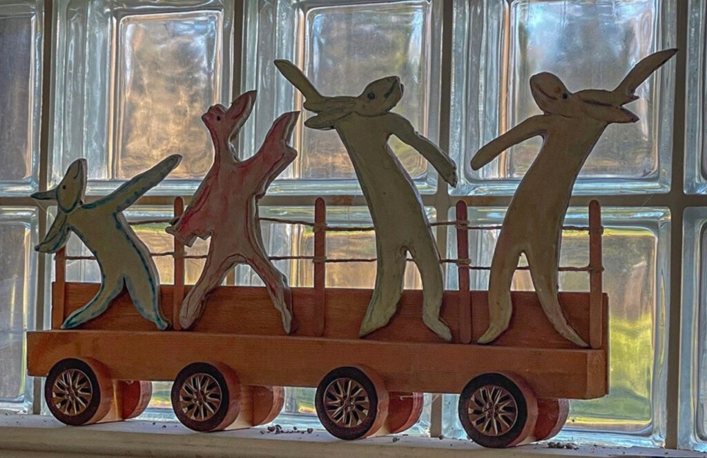 Mary Ann Bowman • <em>Let Loose on Wheels</em> • Wood, stoneware • 24″× 12″× 5″ • $750.00