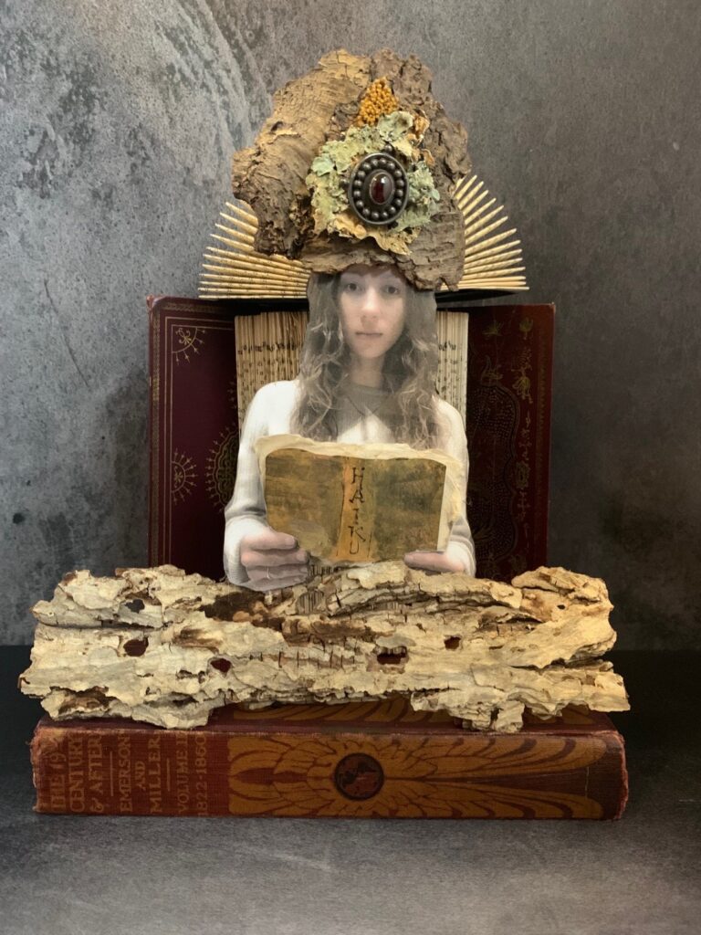 Teresa Yatsko • <em>Haiku</em> • Upcycled  books, tree bark, lichen • 8″× 12″× 6″ • $150.00<a class="purchase" href="https://state-of-the-art-gallery.square.site/product/teresa-yatsko-haiku/3505" target="_blank">Buy</a>