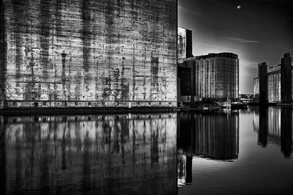 A.M. Dunford • <em>Moonset Silo City</em> • Fine art print on Canson paper, framed • 19½″× 13½″ • $140.00