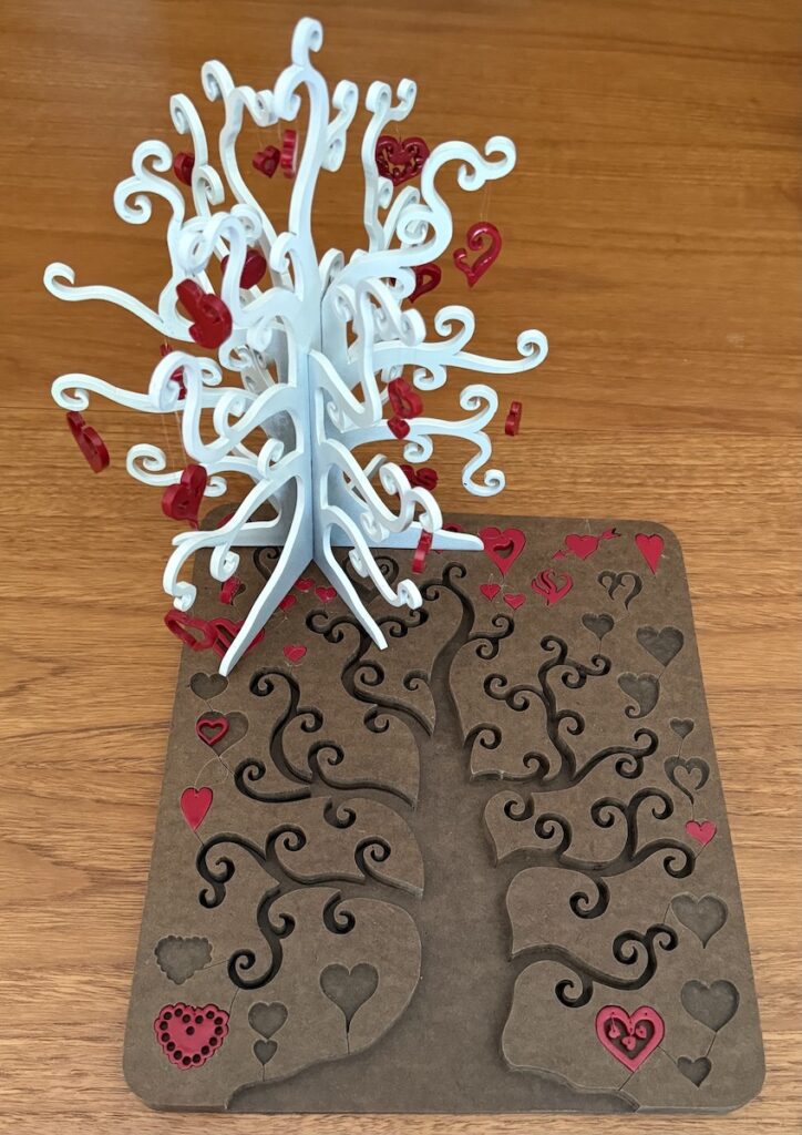 Frances L. Fawcett • <em>Heart Tree</em> • Masonite, paint, fish line • 9″× 10½″× 9″ • NFS