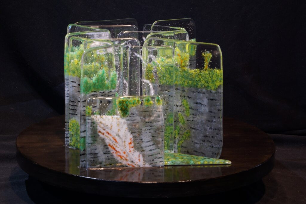 <span class="award_name">Honorable Mention</span>John Kirkman&nbsp;• <em>Upper Taughannock Gorge Mist</em>&nbsp;• Fused glass, cold worked, silicone rubber, wood base&nbsp;• 10¾″×&nbsp;24″×&nbsp;20″&nbsp;• $6,000.00<a class="purchase" href="https://state-of-the-art-gallery.square.site/product/john-kirkman-upper-taughannock-gorge-mist/W5SQ7NRQWIUN4QCZ2UK5JEZZ" target="_blank">Buy</a>
