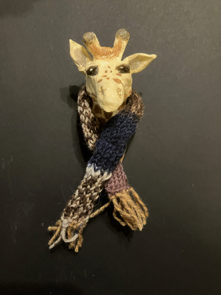 Margy Nelson&nbsp;• <em>Winter Wardrobe 3 (Giraffe)</em>&nbsp;• Mixed media&nbsp;• 8″×&nbsp;8″×&nbsp;3″&nbsp;• NFS