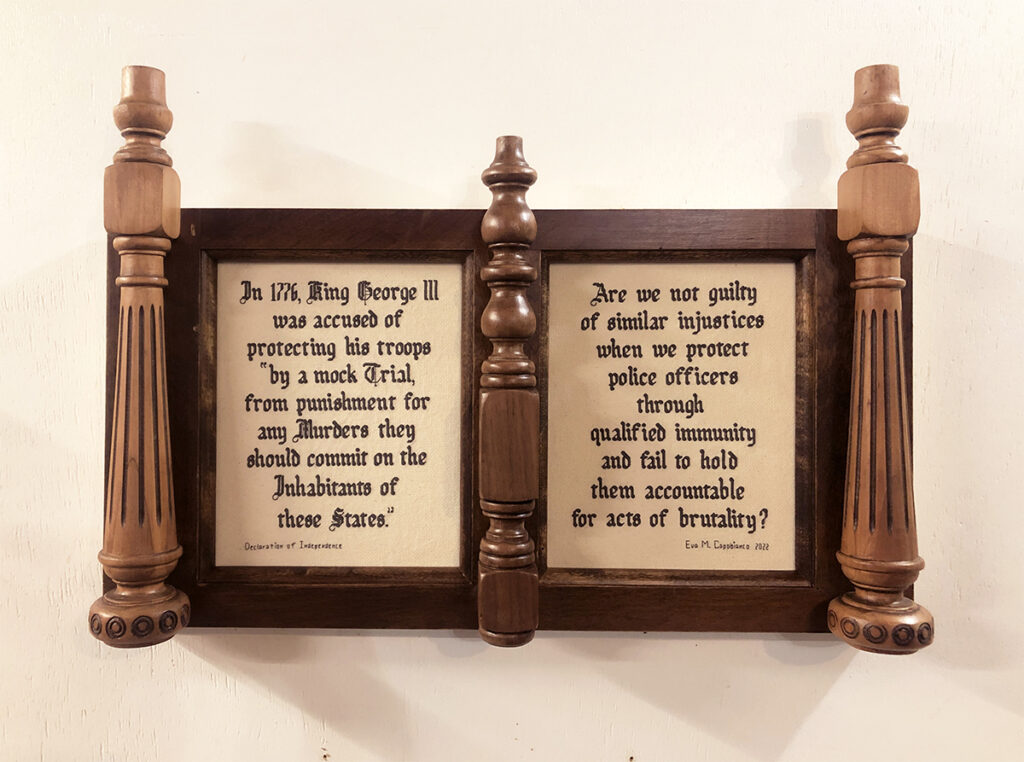 Eva Capobianco&nbsp;• <em>Mock Trials</em>&nbsp;• Found/reused wood and crossstich&nbsp;• 24″×&nbsp;16″×&nbsp;3″&nbsp;• $475.00