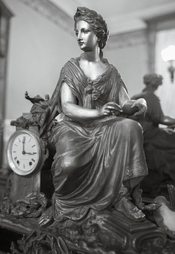 Susan C. Larkin&nbsp;• <em>A Muse with a Clock</em>&nbsp;• Archival digital print&nbsp;• 16″×&nbsp;20″&nbsp;• $150.00